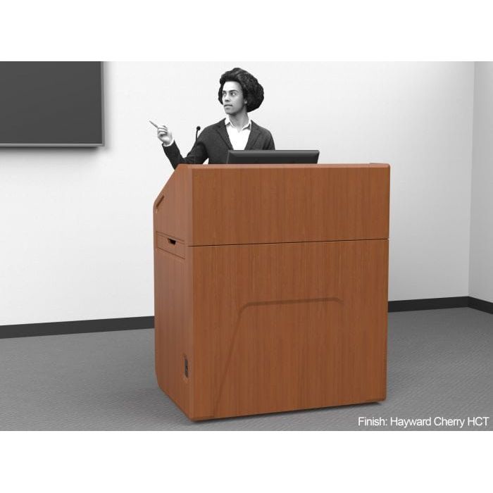 a man giving a presentation behind a multimedia lectern