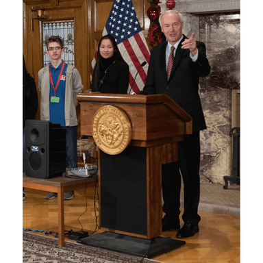 Man giving a speech behind height adjustable podium the keynote