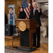 Man giving a speech behind height adjustable podium the keynote