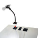 Microphone stand with a red arrow pointing to a mounting plate on a white surface