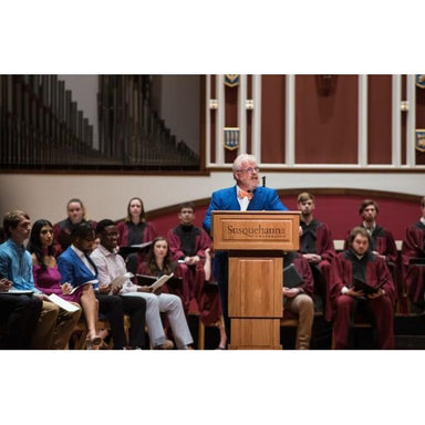 Executive Wood Counselor Lift Adjustable Height Lectern- Being used at a graduation ceremony