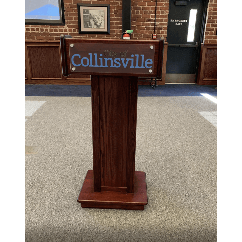 Portable podium with aluminum logo on the front